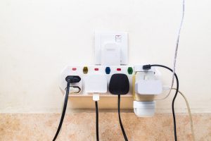Multiple electricity plugs attached to multi adapter is dangerou